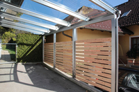 Carport aus Edelstahl mit Glas und Holz